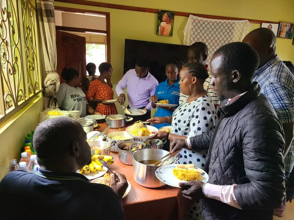 Members preparing a meal for the gathering