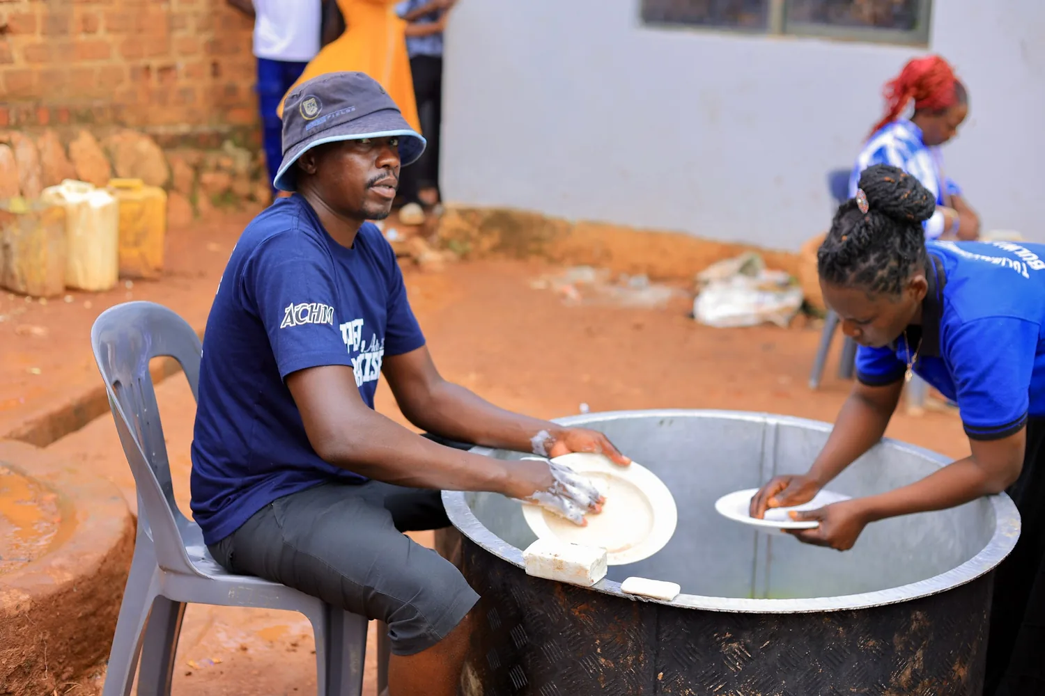 Members washing up together after a gathering