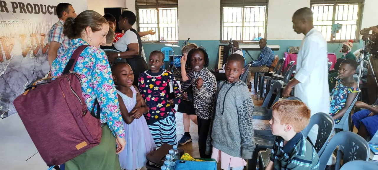 Visitors welcoming the children at the school