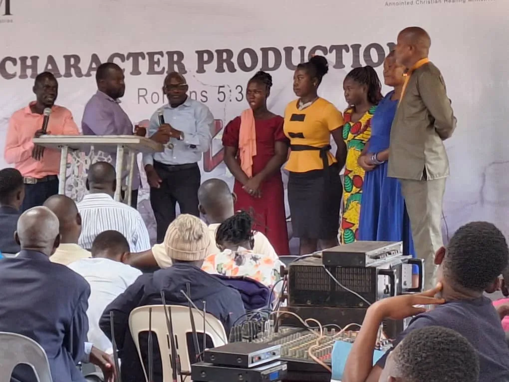 A team serving together at the front of a gathering